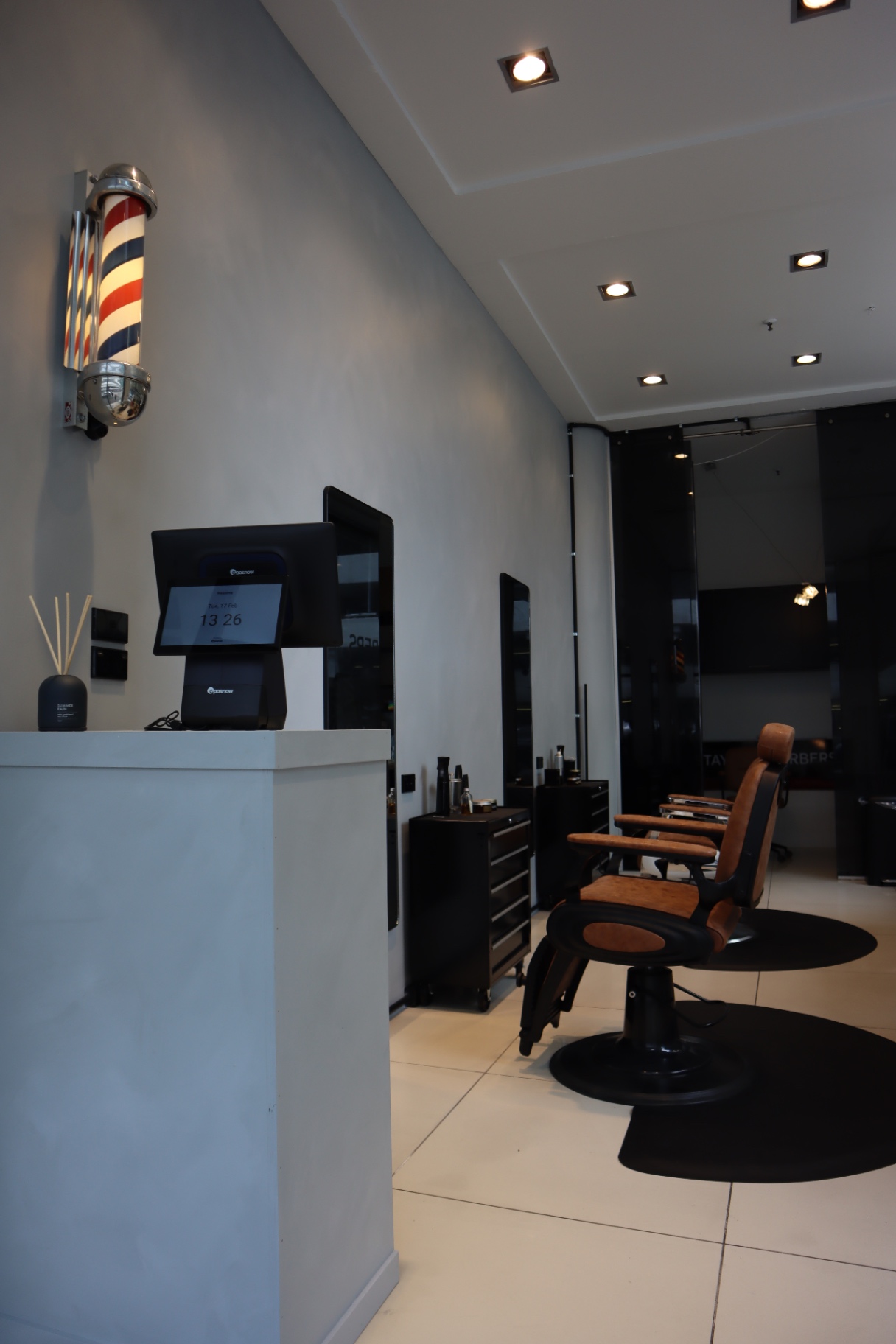 Concrete reception counter with barber pole